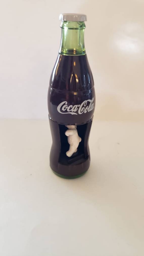 polar bear inside coke bottle