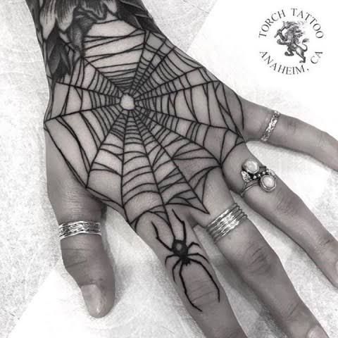 spider web hand tattoo