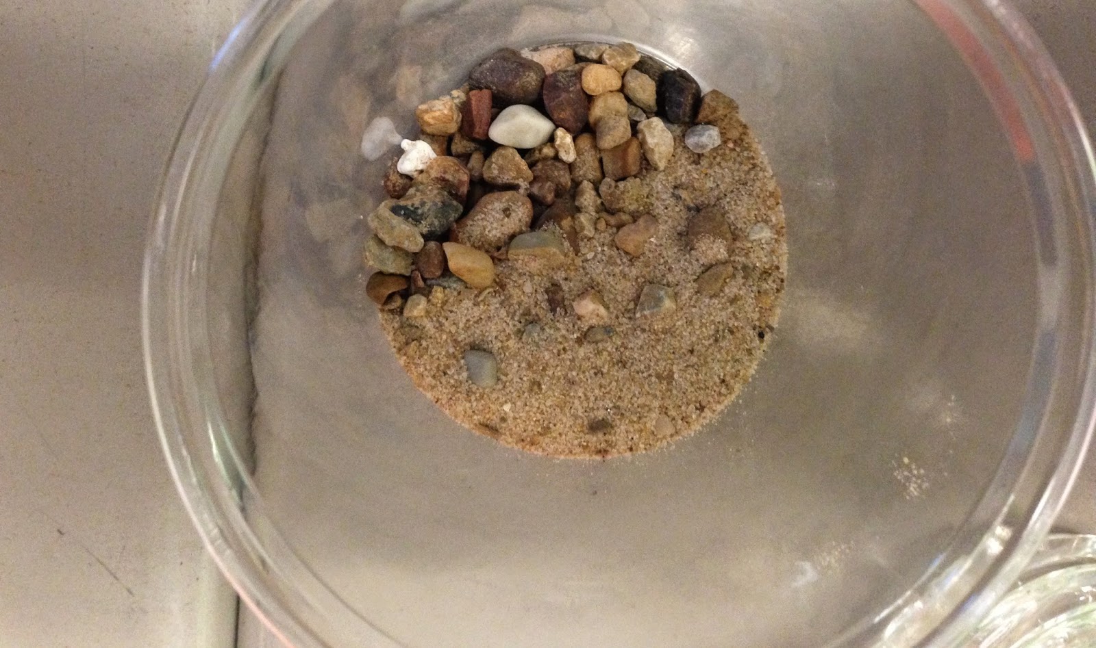 how do you separate a mixture of sand and pebbles