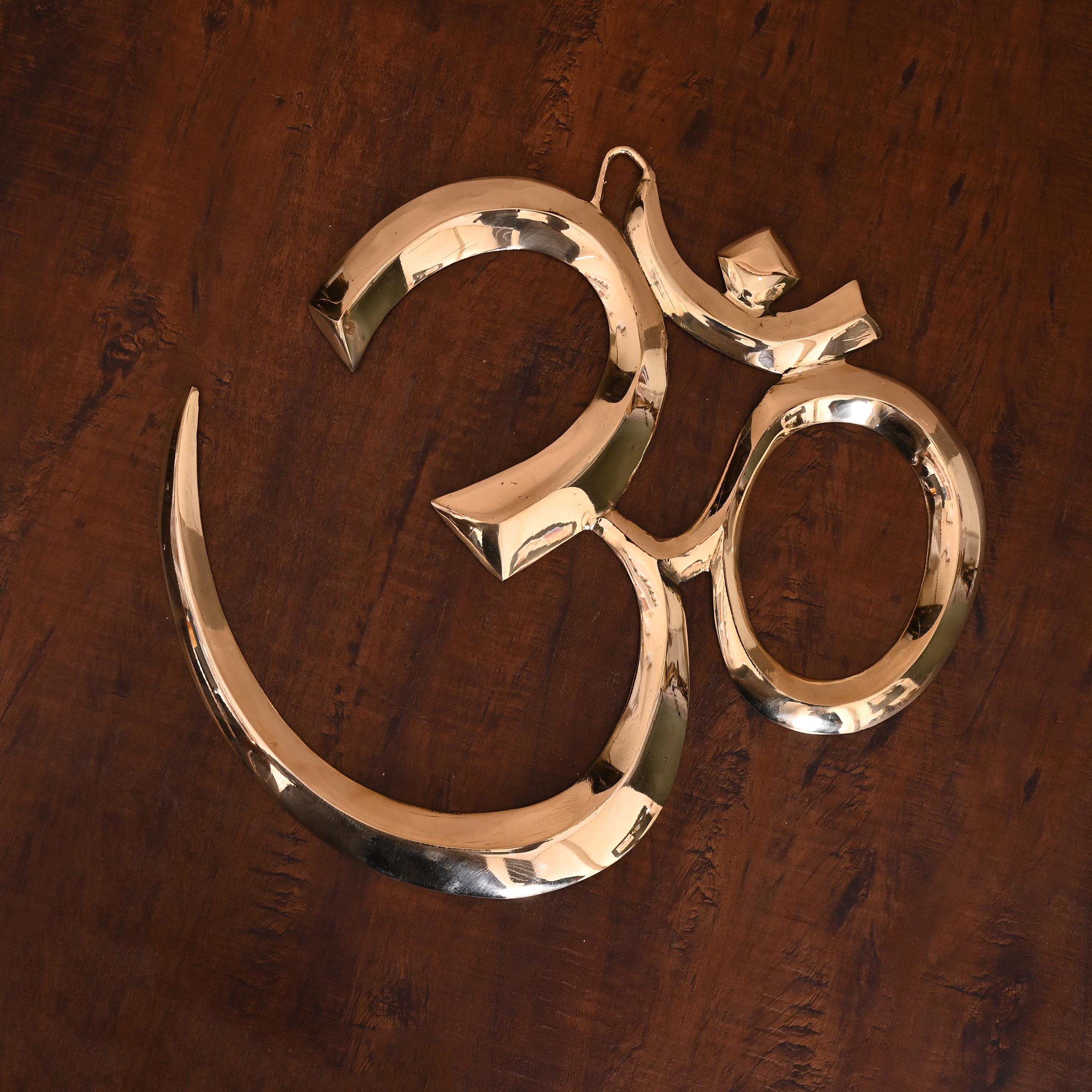 brass om wall hanging