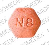 orange hexagon suboxone pill with m on it