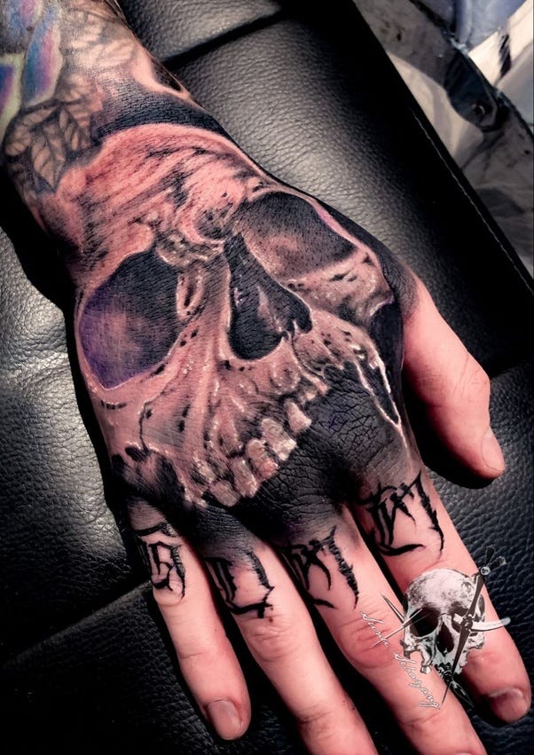 skull hand tattoo