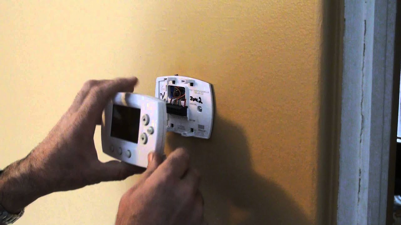 removing honeywell thermostat cover