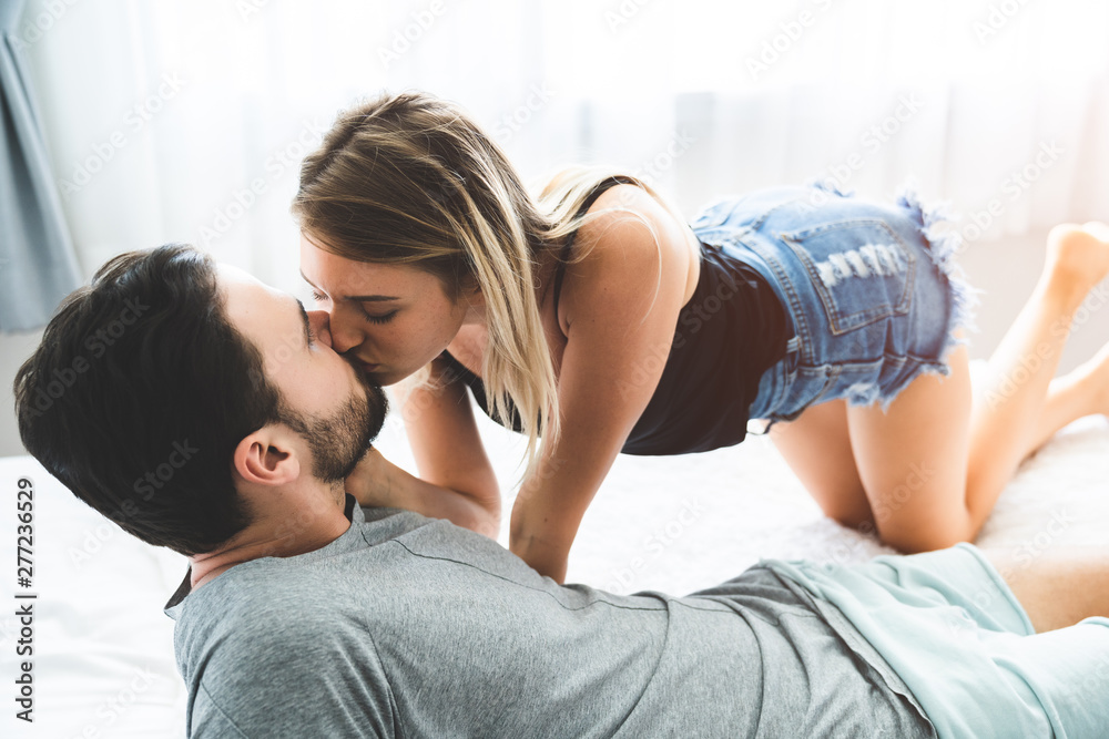 man and woman kissing passionately