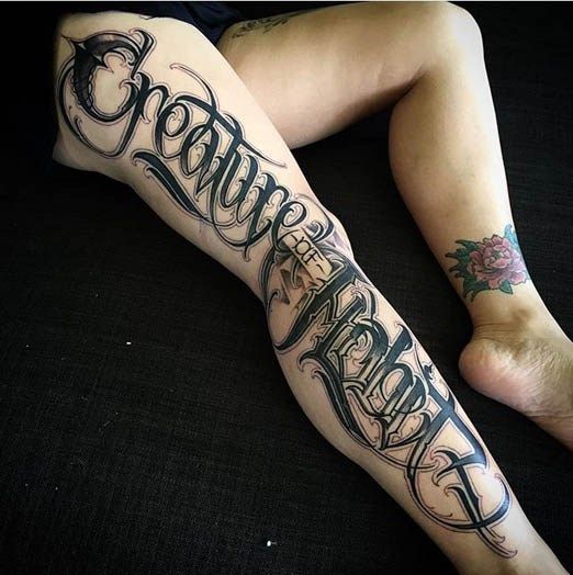 lettering tattoo leg