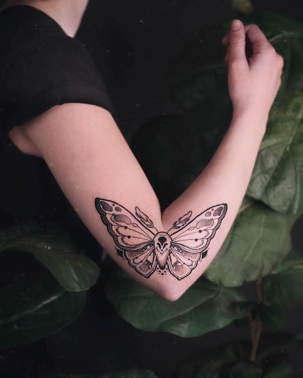 moth tattoo arm