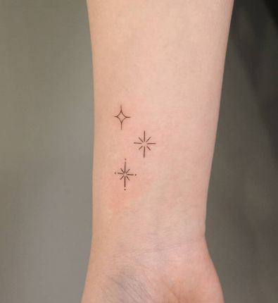 star tattoo on side wrist