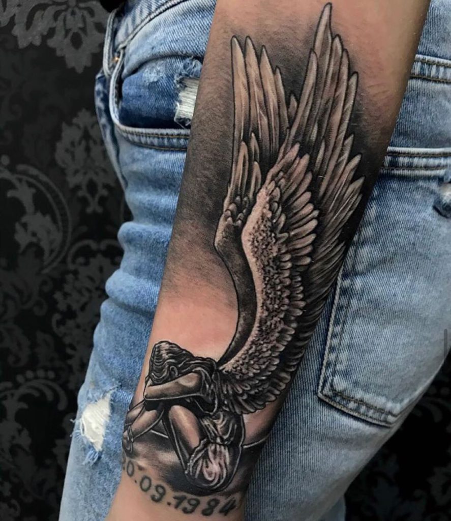 angel on forearm tattoo