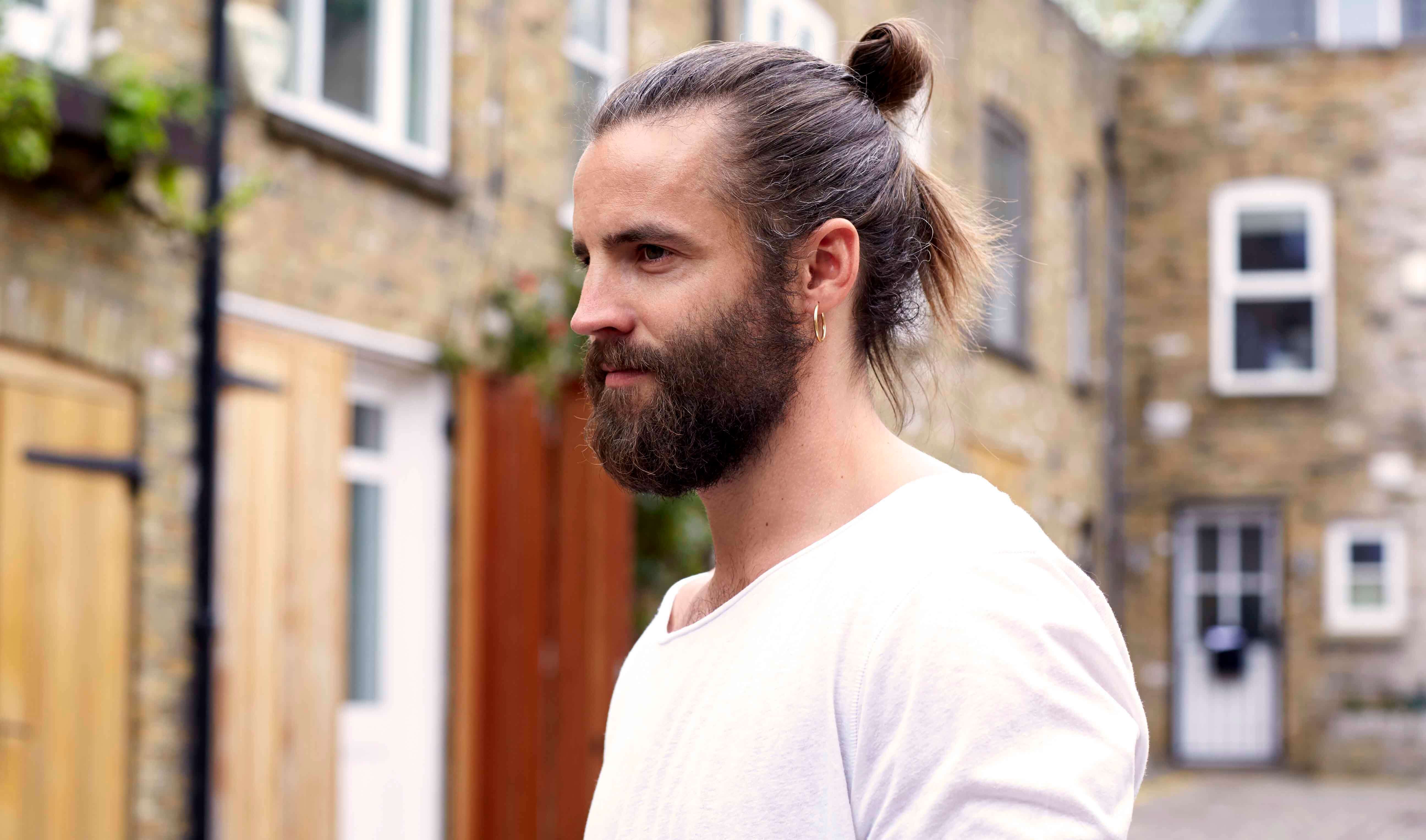 man bun hairstyle with beard