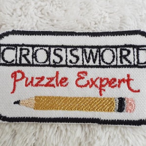 needlework crossword clue