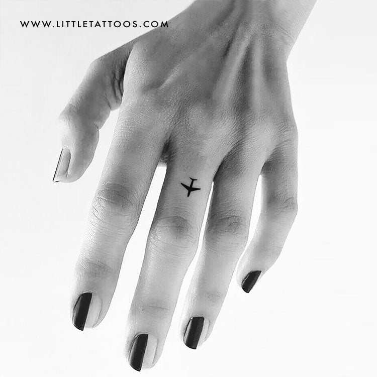 airplane tattoo on hand