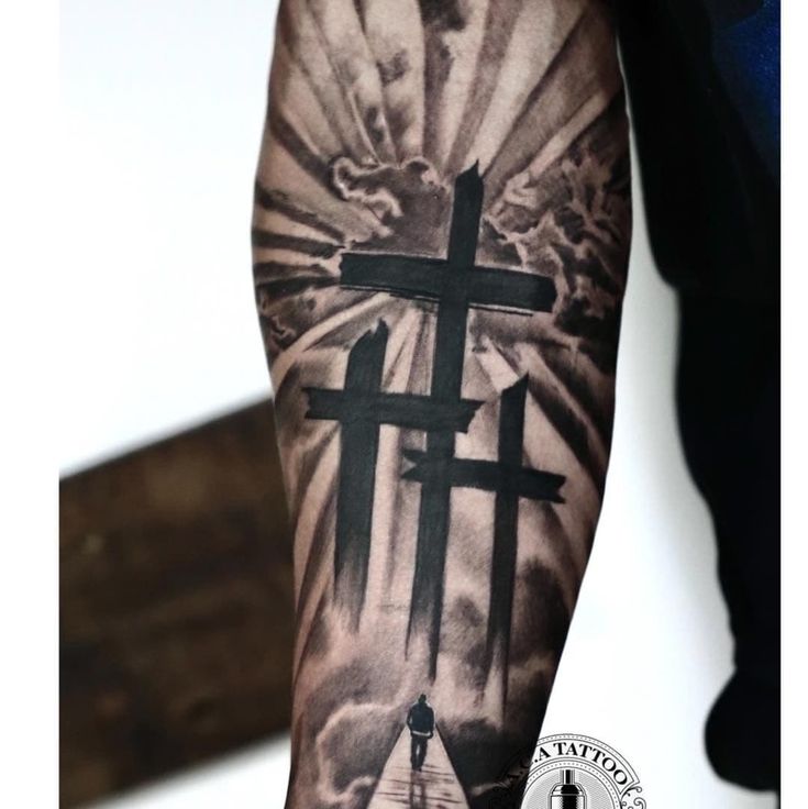 forearm cross tattoo