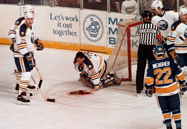 goalie gets throat cut