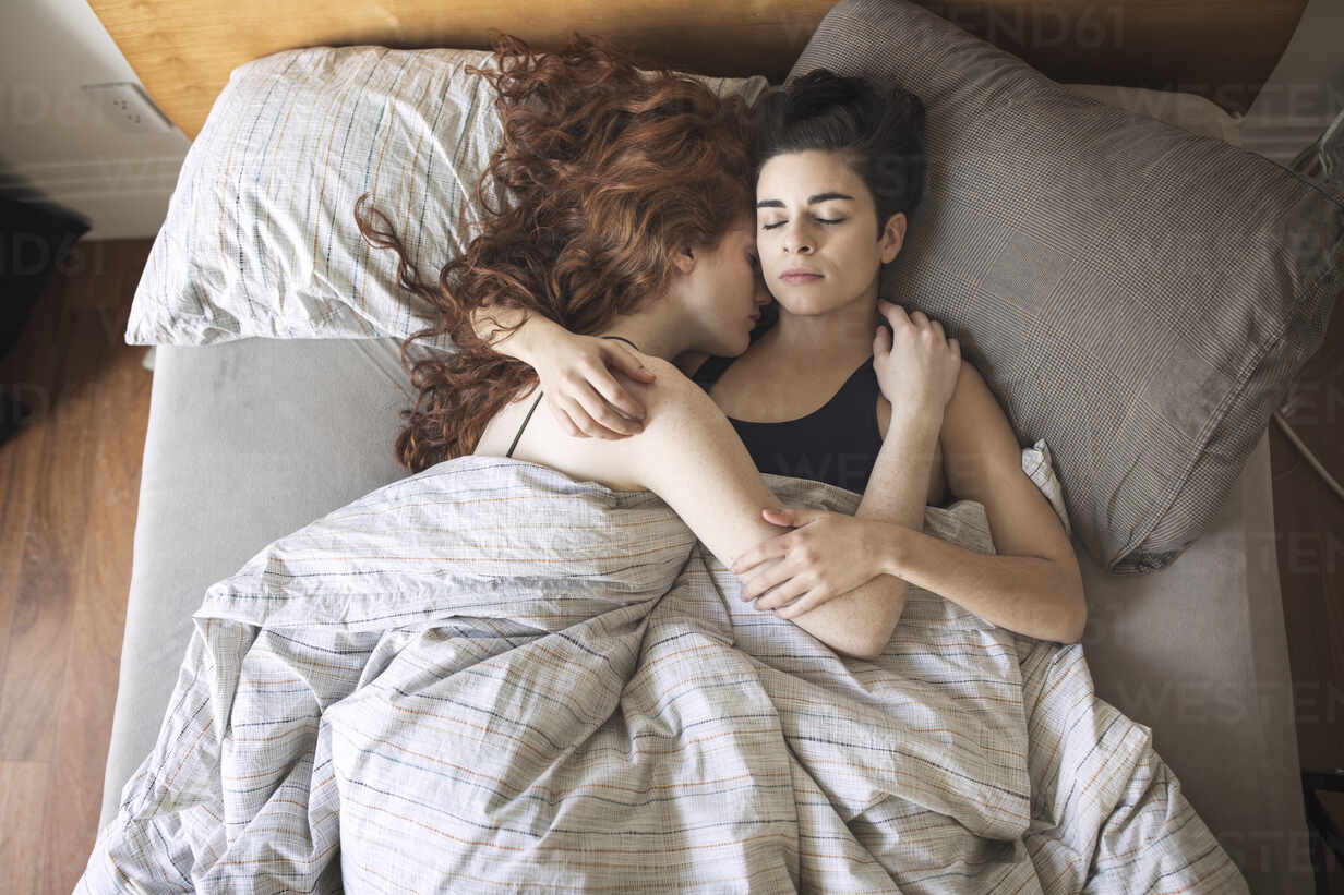 lesbian couple in bed