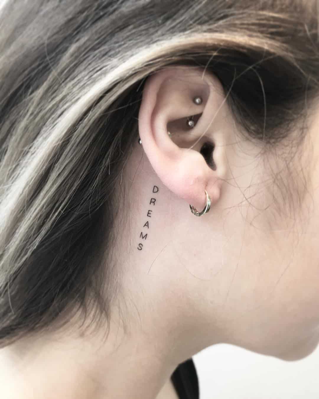 meaningful behind ear tattoos