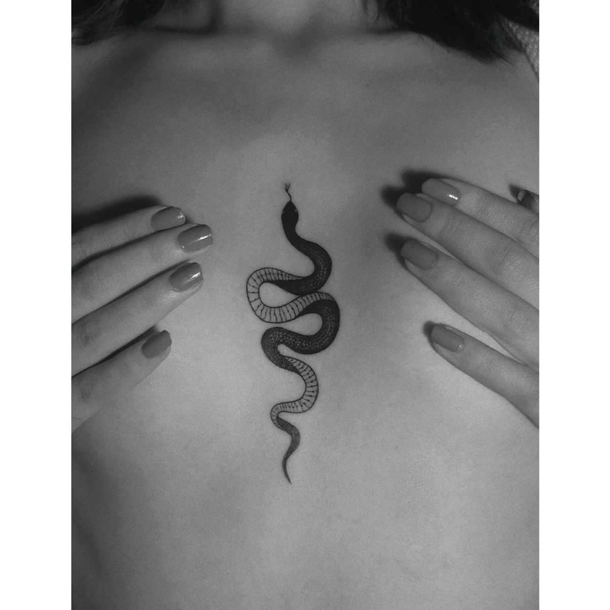 snake chest tattoo